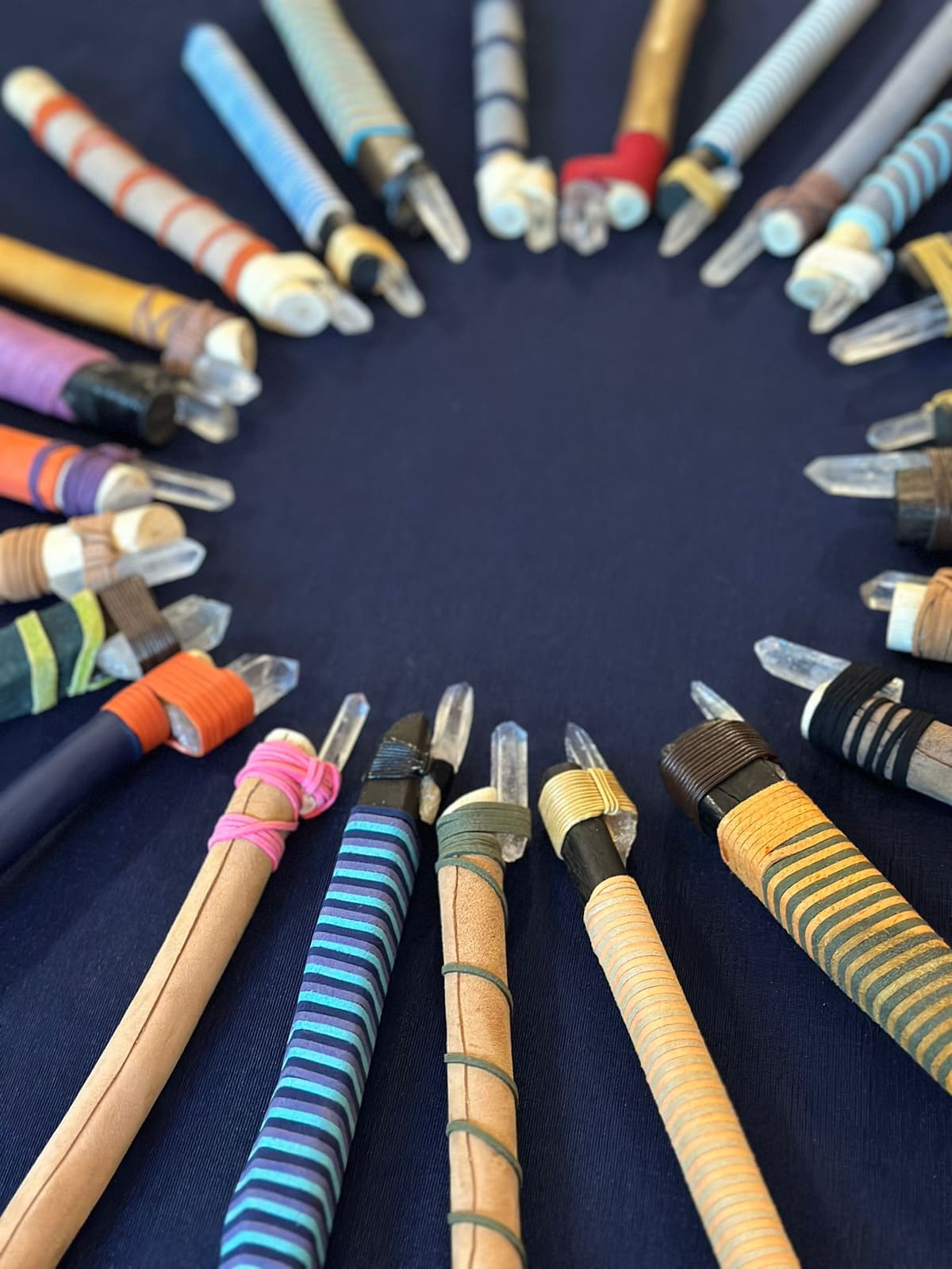 Crystal-tipped healing wands arranged in a sacred circle